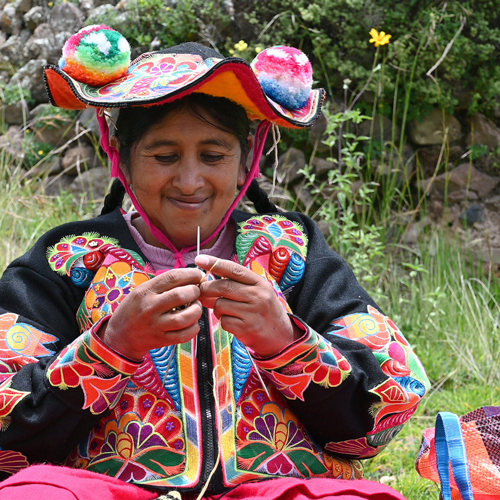 Knitter from Puno in traditional garb